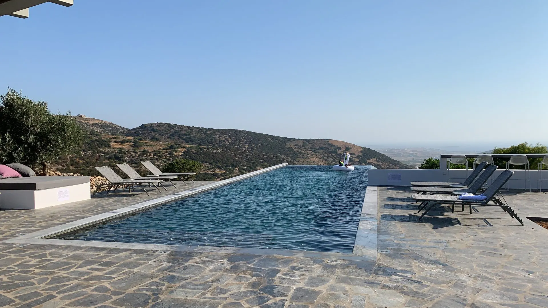 The 20-metre infinity pool by day, looking toward Naxos